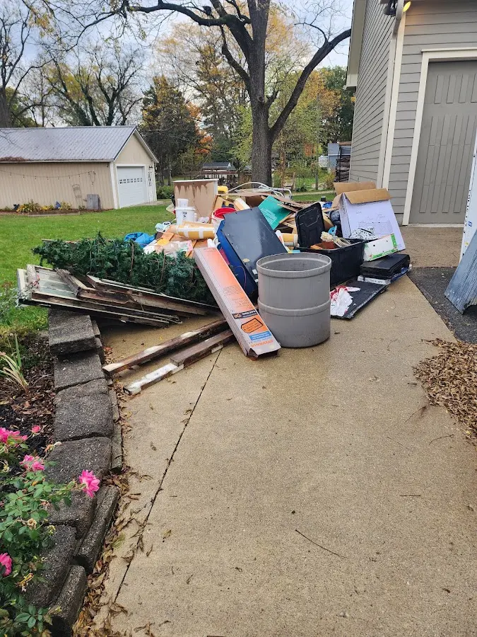 Dumpster being loaded with debris for Roofing Dumpster Rental in Joshua